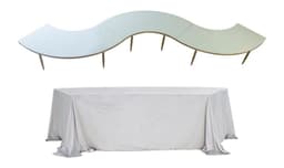 Serpentine S-curve: gold base with black glass tops dressed in colored velvet covers; floor-length tablecloth shown on one module.