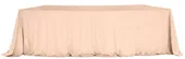 LARGO peach velvet tablecloth on a serpentine (wave) table — seamless top, floor-length drape with soft corner pooling.