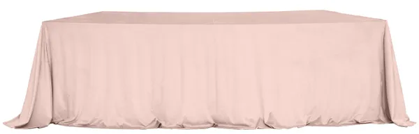 LARGO nude velvet tablecloth on a serpentine (wave) table — seamless top, floor-length drape with soft corner pooling.
