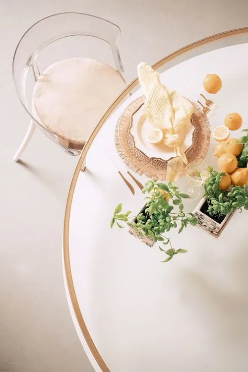 Accent table settings at round table