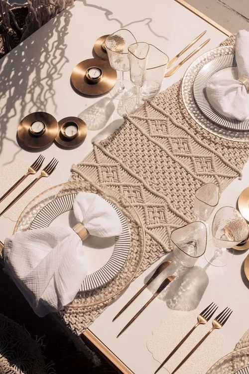 Beige boho table setting with ottomans