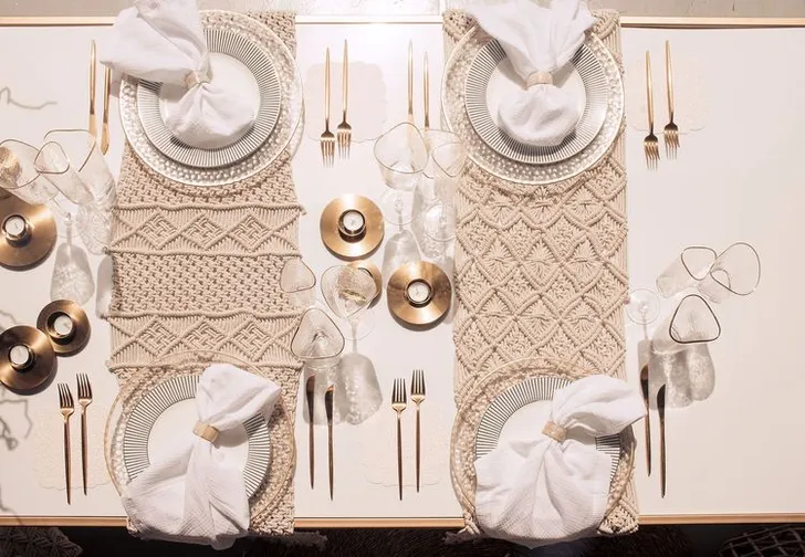 Beige boho table setting with ottomans