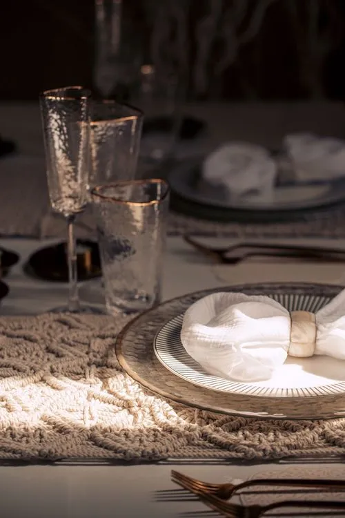 Beige boho table setting with ottomans
