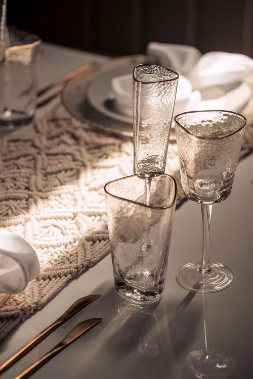 Beige boho table setting with ottomans