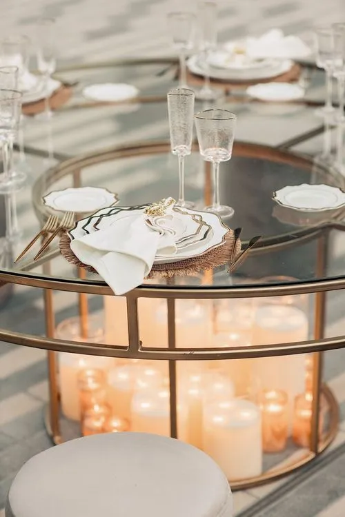 Beige candlelit table setting at round table