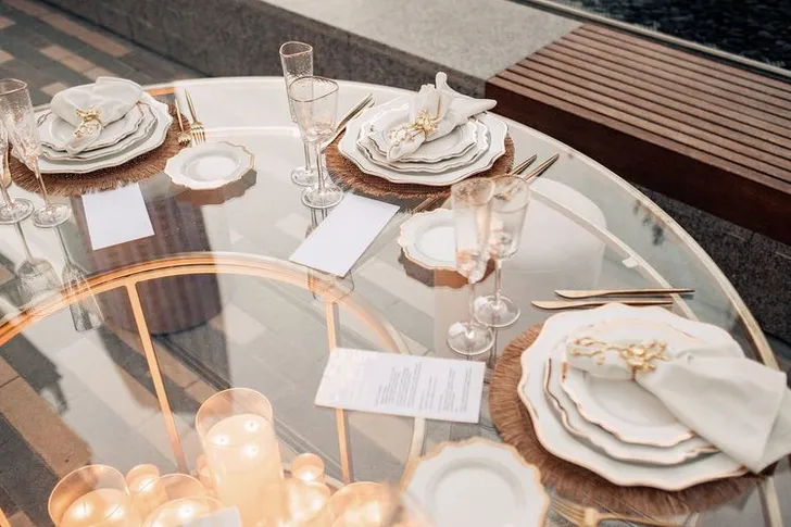 Beige candlelit table setting at round table