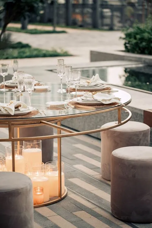 Beige candlelit table setting at round table