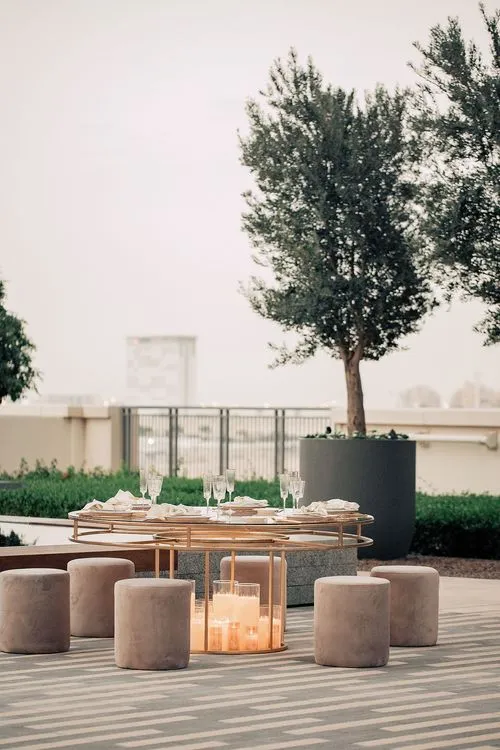 Beige candlelit table setting at round table