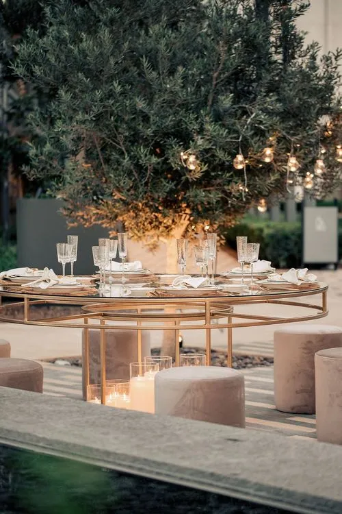 Beige candlelit table setting at round table