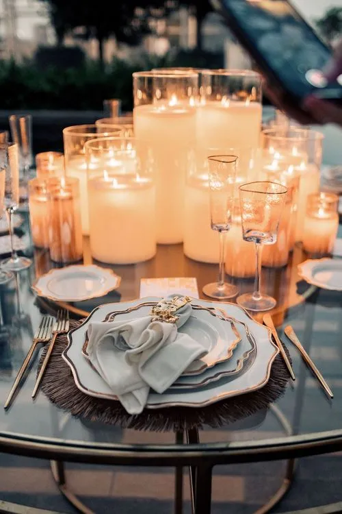 Beige candlelit table setting at round table