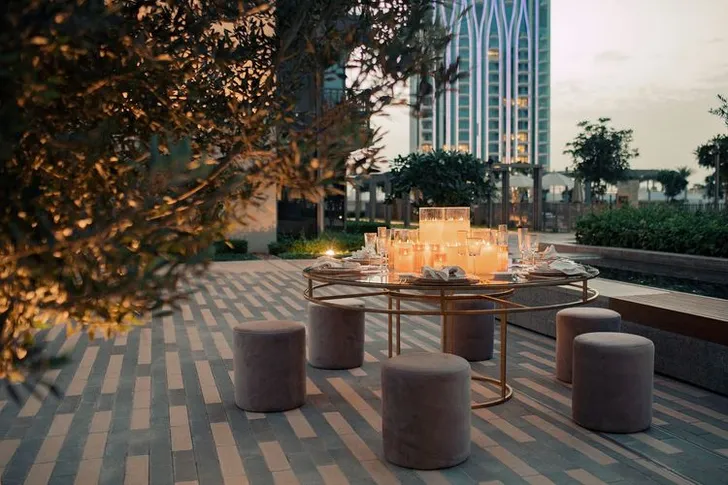 Beige candlelit table setting at round table