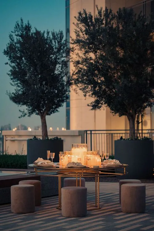 Beige candlelit table setting at round table