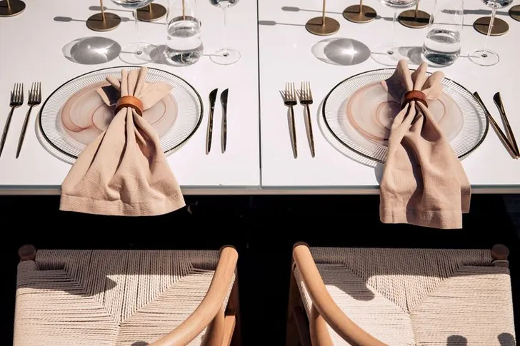 Beige set with boho accents on a white rectangular table