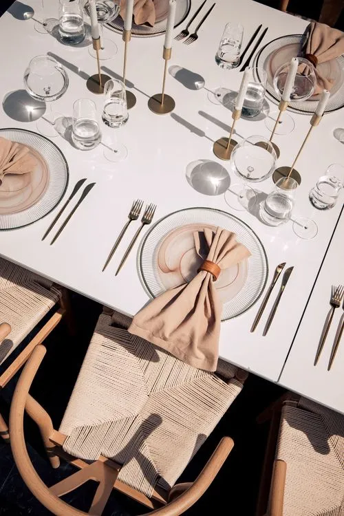 Beige set with boho accents on a white rectangular table