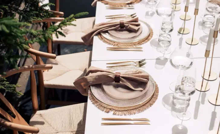 Beige set with boho accents on a white rectangular table