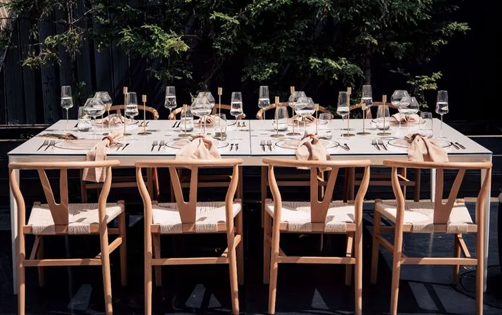 Beige set with boho accents on a white rectangular table