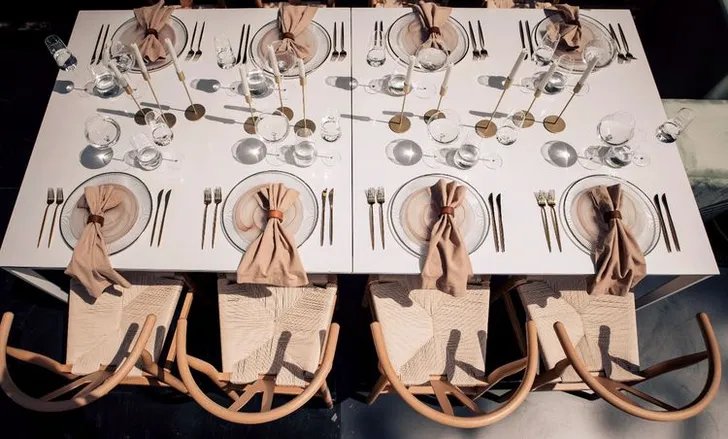 Beige set with boho accents on a white rectangular table