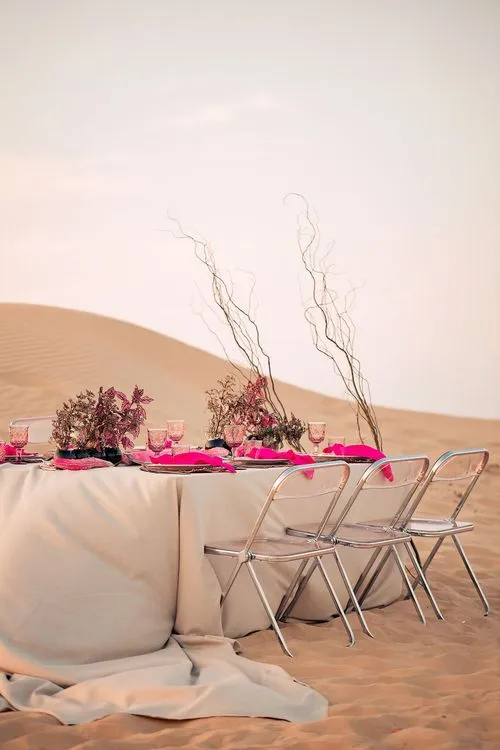 Beige desert  tablescape with fuchsia accents