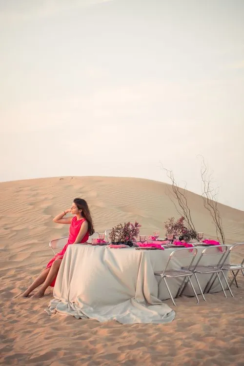 Beige desert  tablescape with fuchsia accents
