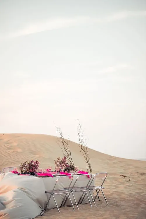 Beige desert  tablescape with fuchsia accents
