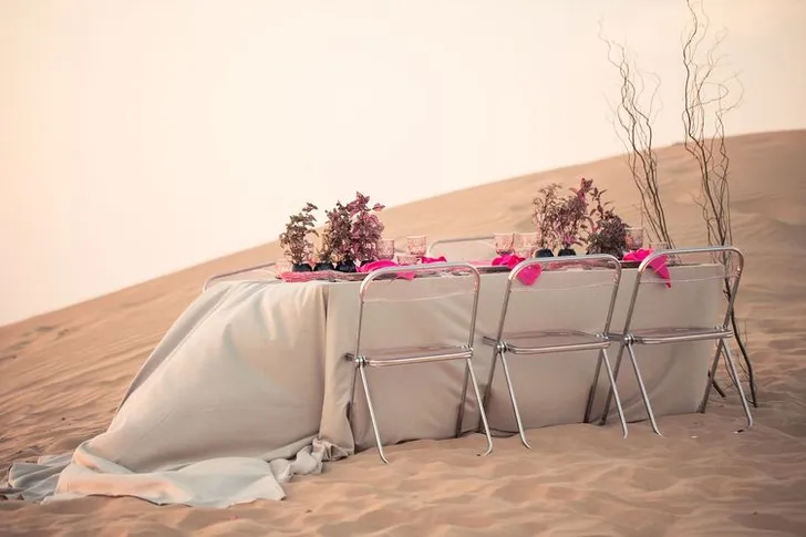 Beige desert  tablescape with fuchsia accents