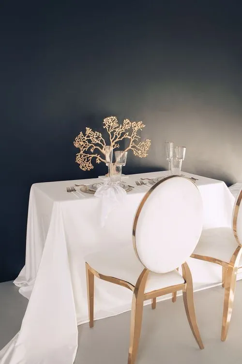 White set with gold accents on a rectangular table