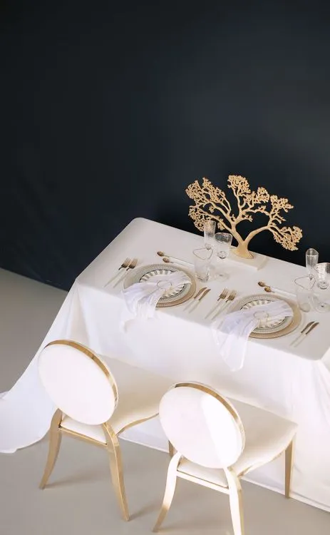 White set with gold accents on a rectangular table