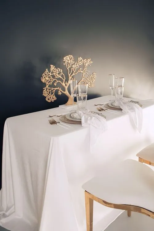 White set with gold accents on a rectangular table
