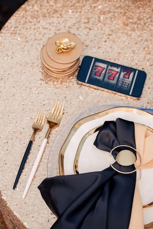 Black-gold table setting at round table