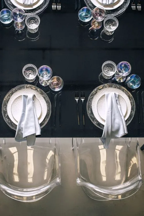 Black-white table setting at rectangular table