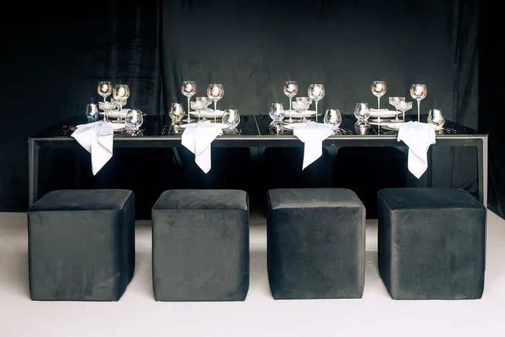 Black-white table setting at rectangular table