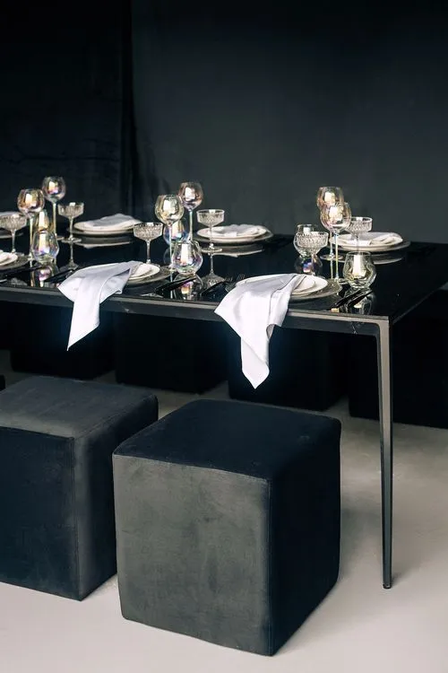 Black-white table setting at rectangular table