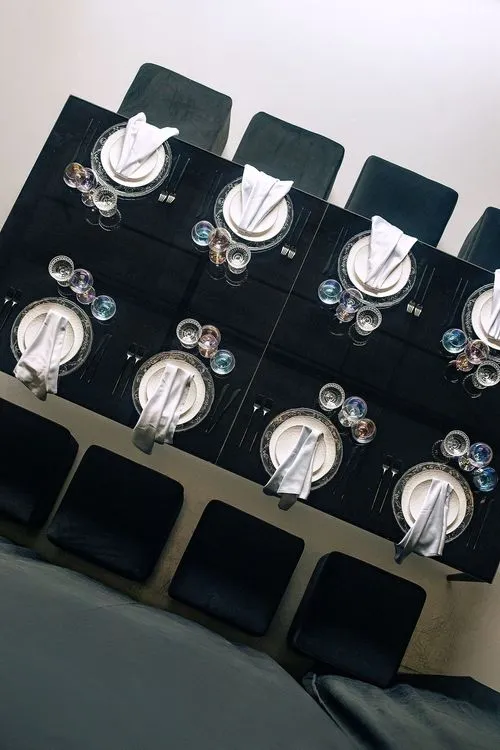 Black-white table setting at rectangular table