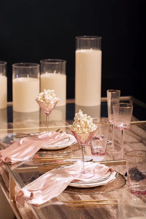 Candlelit Duo — Sequin Table, Cozy Poufs, “Titanic”