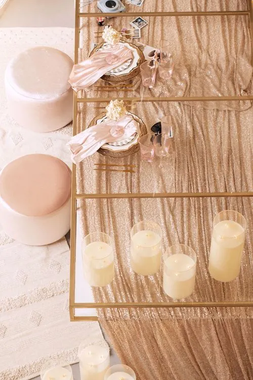 Candlelit Duo — Sequin Table, Cozy Poufs, “Titanic”