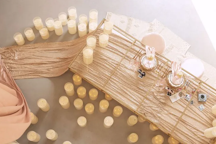 Candlelit Duo — Sequin Table, Cozy Poufs, “Titanic”