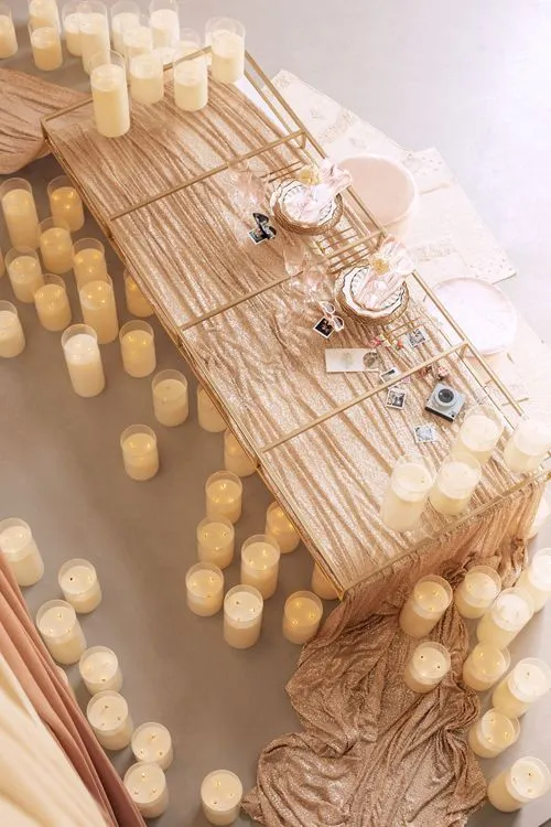 Candlelit Duo — Sequin Table, Cozy Poufs, “Titanic”