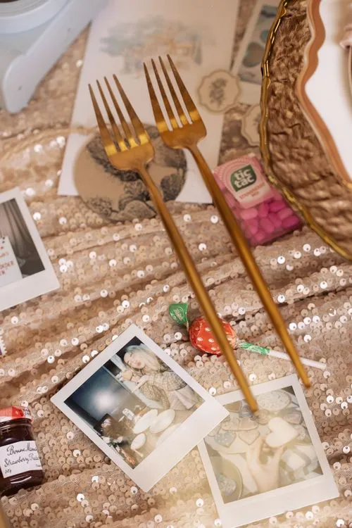 Candlelit Duo — Sequin Table, Cozy Poufs, “Titanic”