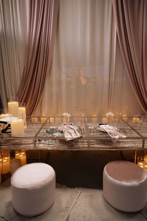 Candlelit Duo — Sequin Table, Cozy Poufs, “Titanic”