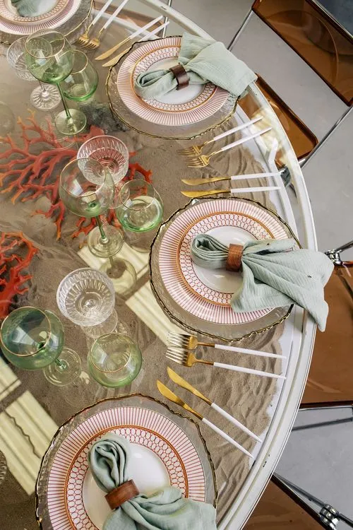 Glass round table coral dune decor