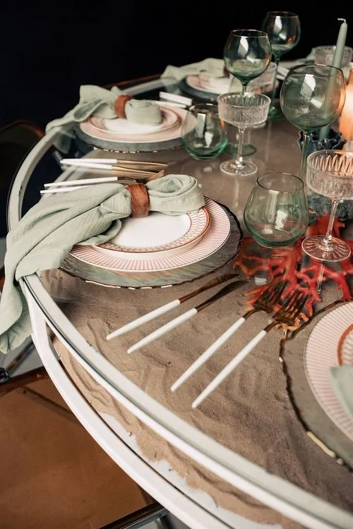 Glass round table coral dune decor