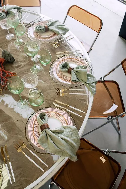 Glass round table coral dune decor