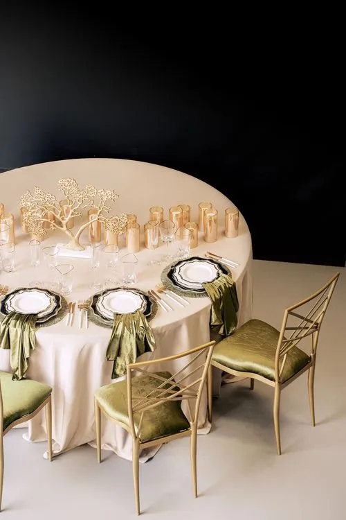 Green table setting at round table