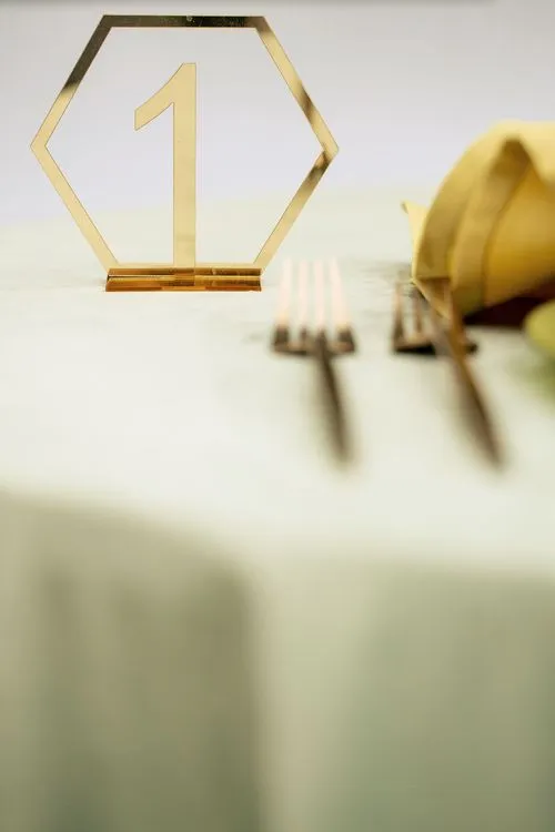 Green table setting with ottomans