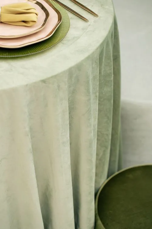 Green table setting with ottomans