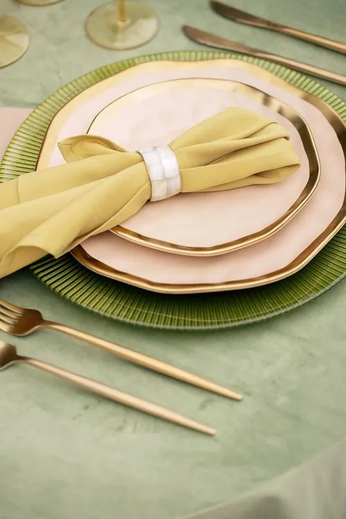 Green table setting with ottomans