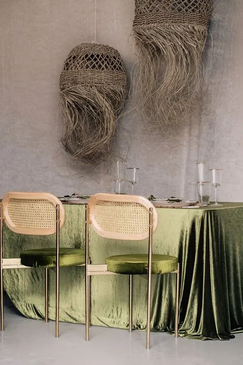 Green velvet tablescape rattan chairs