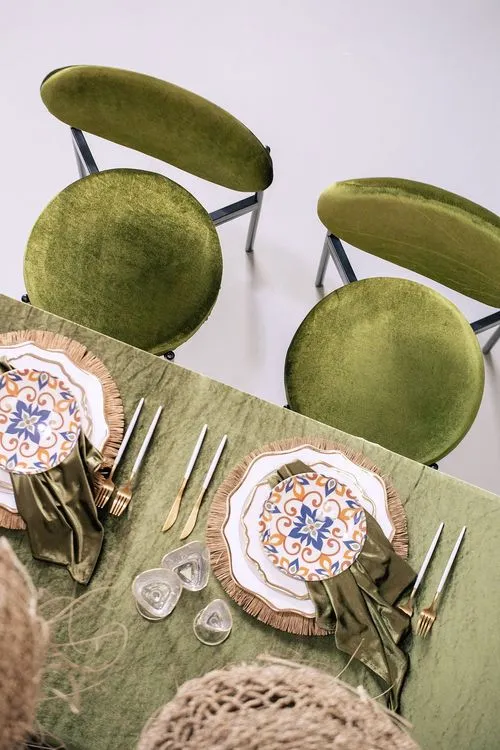 Green velvet tablescape rattan chairs