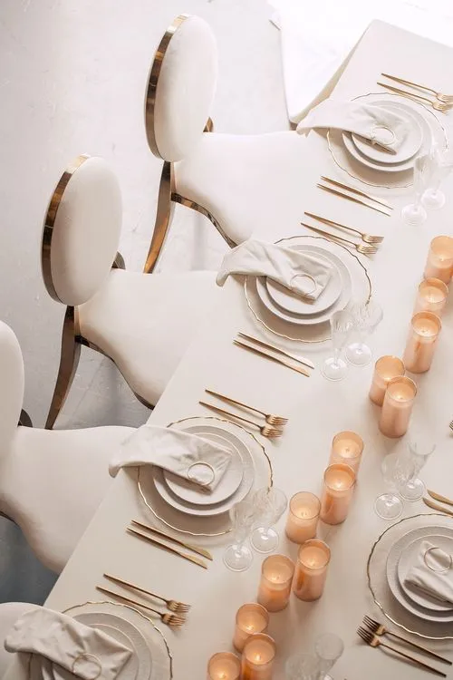 Ivory table service at long rectangular table