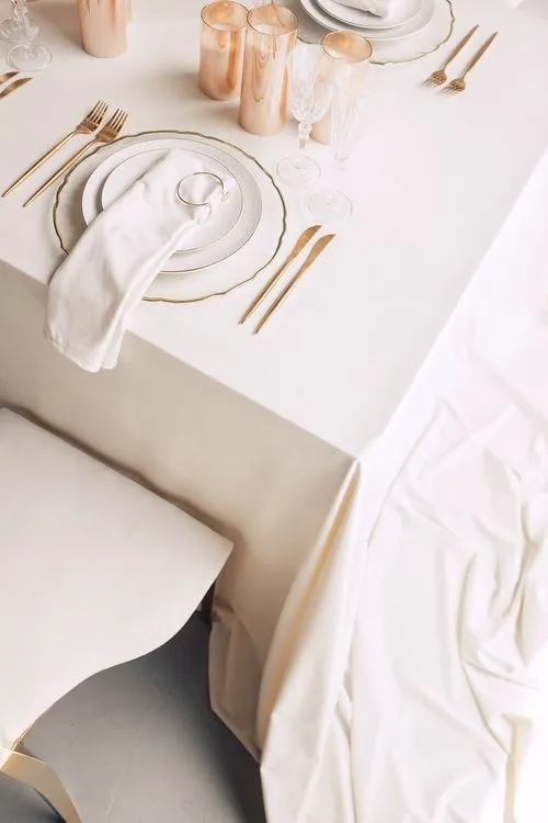 Ivory table service at long rectangular table
